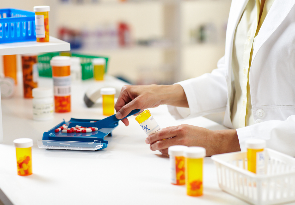 Pharmacist Filling Prescription of Pills Filling a prescription.